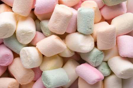 A pile of small colored puffy marshmallows.の写真素材