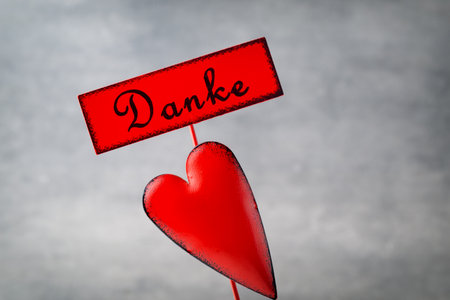 Red heart on the gray metal background.の写真素材