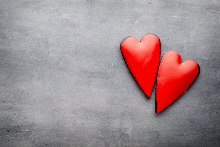 Red heart on the gray metal background.の写真素材
