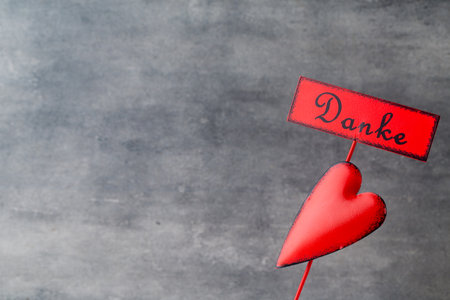 Red heart on the gray metal background.の写真素材