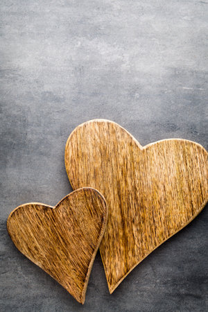 Wooden rustic heart on the grey background.の写真素材
