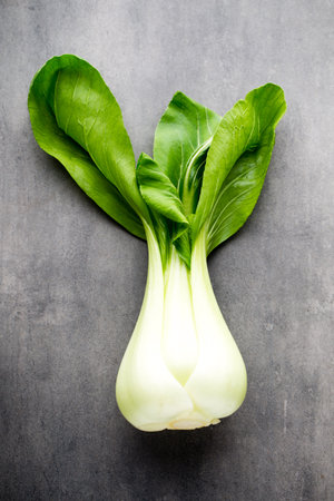 Fresh spinach on the gray mettal background.の写真素材