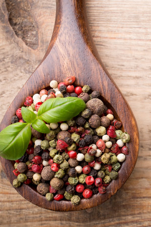 Spice mix a wooden spoon on a wooden background.の写真素材