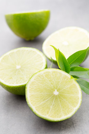 Juicy ripe lime an gray table.の写真素材