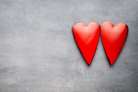 Red heart on the gray metal background.の写真素材