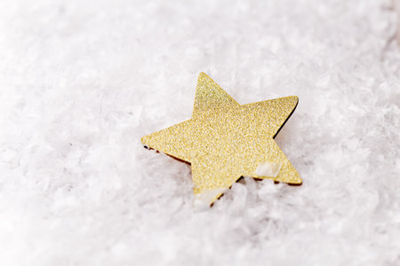 Silver star with christmas balls on the sparkling background.