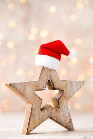 Christmas decor with angel santa hat. Vintages background.の写真素材