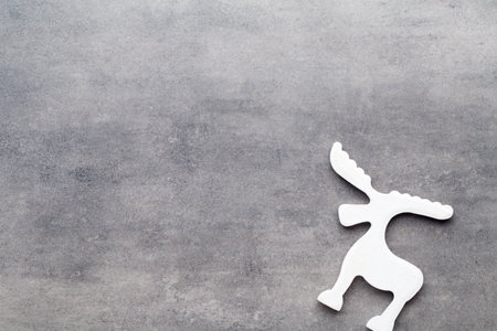 Christmas background. White tree decorations on a gray background. Deer. Spruce. Star. Angel.の写真素材