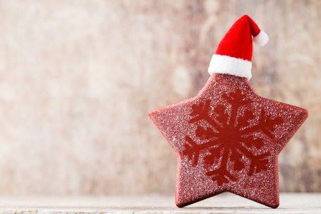 Christmas stars decor with santa hat. Holiday bohek background.の写真素材