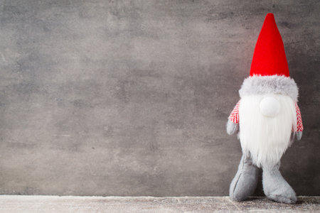 Christmas gnome decor with santa hat. Holiday bohek background.の写真素材