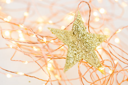 Christmas gold stars decoration on abstract background.