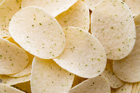 Rippled fresh organic potato chips background.