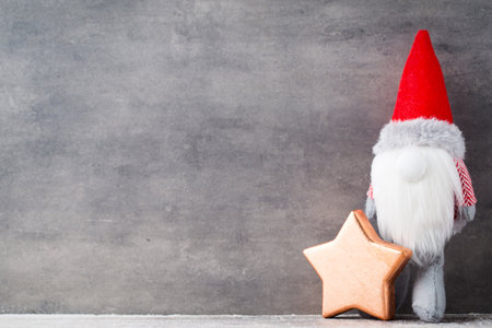 Christmas gnome decor with santa hat. Holiday bohek background.の写真素材