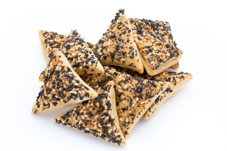Crisps with nuts and seeds stacked on a white background.