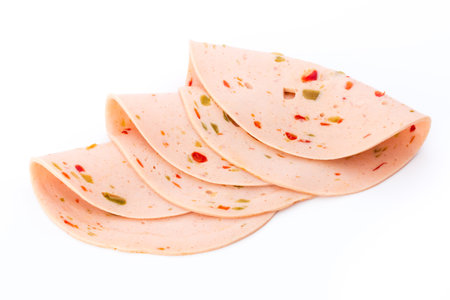 Sliced boiled ham sausage isolated on white background, top view.の写真素材