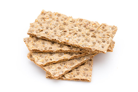 Stack of wholegrain crispy bread with sunflower, chia and sesames seedsの写真素材