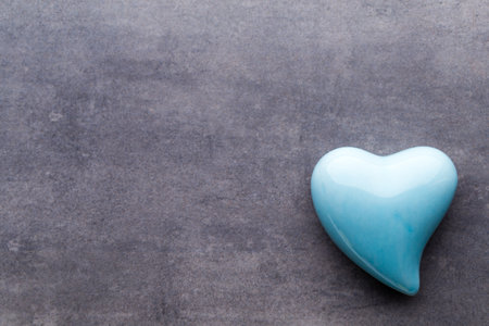 Valentines day greeting card. Colored heart on the gray background. View from above. Flat lay.の写真素材