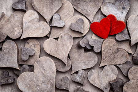 Rustic Valentines Day background with hearts.の写真素材