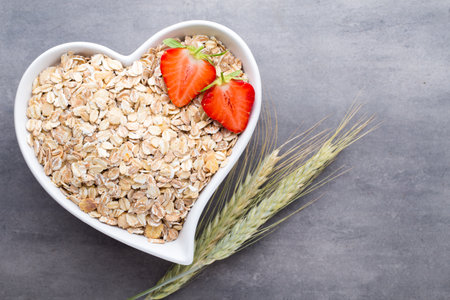 Fried oat flakes in a heart bowl.