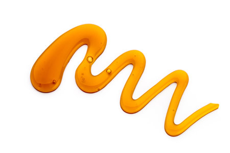 Honey drop isolated on white background.の写真素材