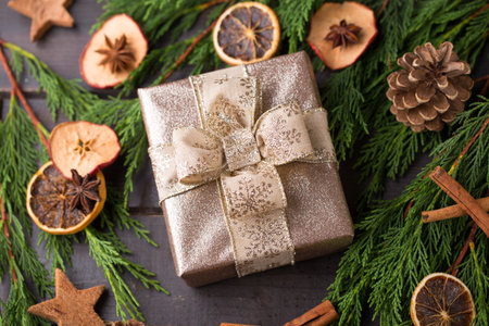 Christmas gift on the antique wooden background.