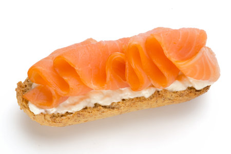 Bread with fresh salmon fillet isolated on white background, top view.