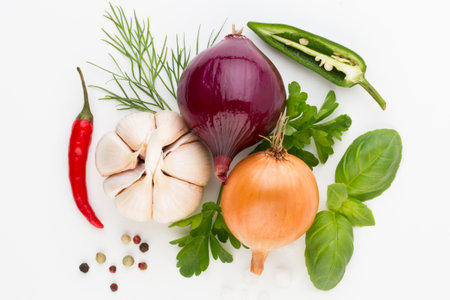 Onion and spices isolated on white background, top view.の写真素材