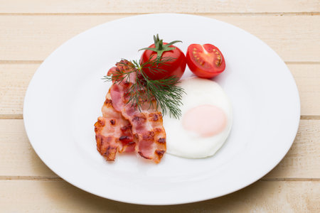 Two fried eggs and bacon for healthy breakfast . selective focusの写真素材