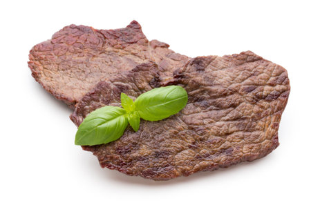 Grilled bio beef steaks with spices isolated on white background.の写真素材
