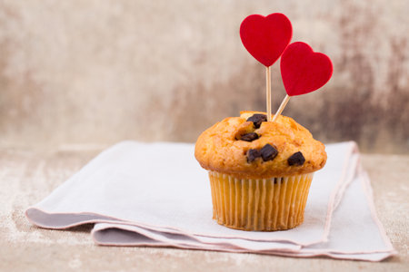 Chocolate muffins with heart vintage background, selective focus.の写真素材