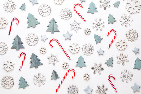 Christmas greeting card. Festive decoration on white wooden background. New Year concept. Copy space.  Flat lay. Top view.の写真素材