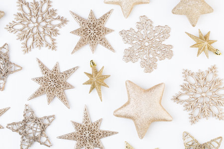 Christmas composition. Stars decorations, on white background. Christmas, winter, new year concept. Flat lay, top view, copy space.の写真素材