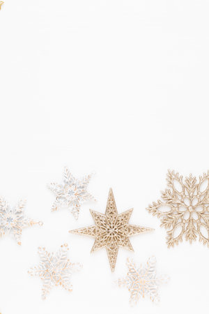Christmas composition. Stars decorations, on white background. Christmas, winter, new year concept. Flat lay, top view, copy space.の写真素材