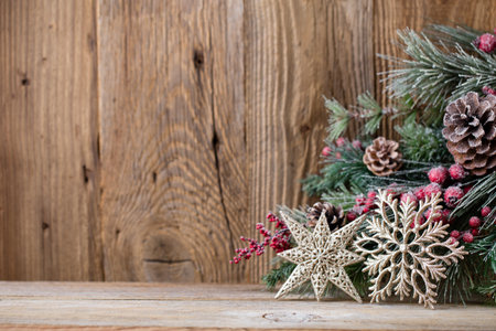 Christmas greeting card. Festive decoration on wooden background. New Year concept. Copy space.  Flat lay. Top view.の写真素材
