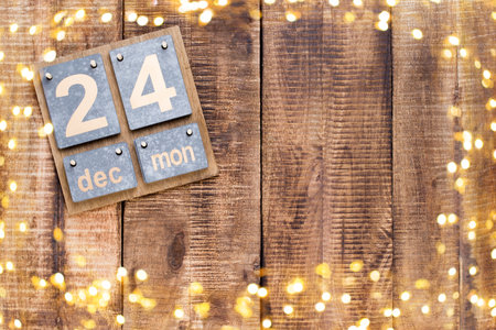 Christmas greeting card. Festive decoration on wooden background. New Year concept. Copy space.  Flat lay. Top view.の写真素材