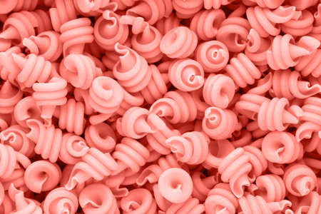 Italian living coral color macaroni pasta full background.