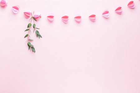 Colorful paper garland of hearts on the living coral background. Valentine day greeting cards.の写真素材