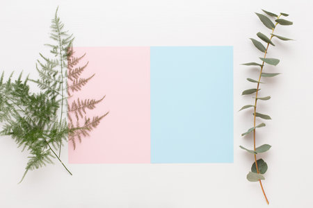 Flowers composition. Paper blank, flowers, eucalyptus branches on pastel  background. Flat lay, top view, copy spaceFlat lay stiil life.の写真素材