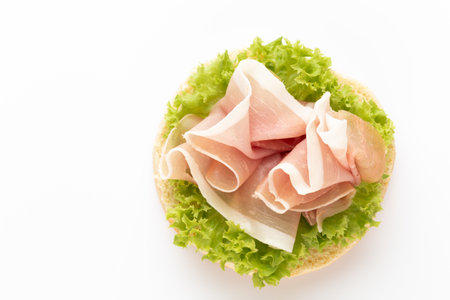 Sandwich with salami sausage on white background.の写真素材