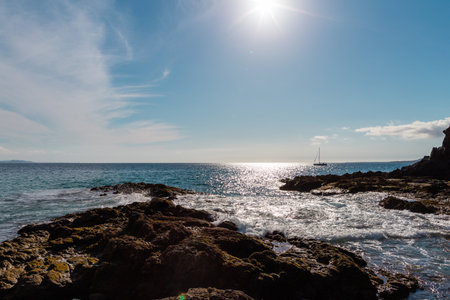 Beautiful beach on the island of Lanzarote. Sandy beach surrounded by volcanic mountains / Atlantic Ocean and wonderful beach. Lanzarote. Canary Islands の写真素材
