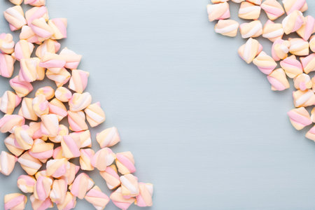 Colorful marshmallows background with copy space. Top view. Flat lay.の写真素材