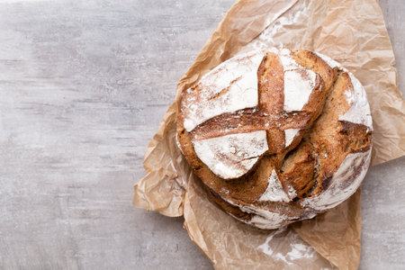 Bread top view of, black and rye loaves on black.の写真素材