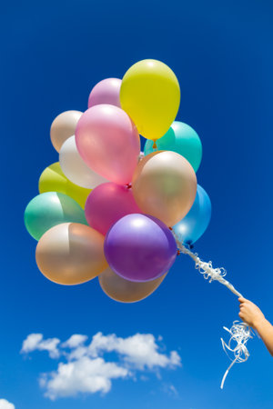 Colorful balloons done with a retro filter effect. Concept of happy birth day in summer and wedding, honeymoon party use for background. Vintage color tone style.の写真素材