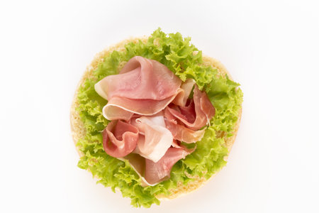 Sandwich with salami sausage on white background.の写真素材