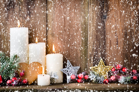 Christmas Advent candles with festive decor.の写真素材
