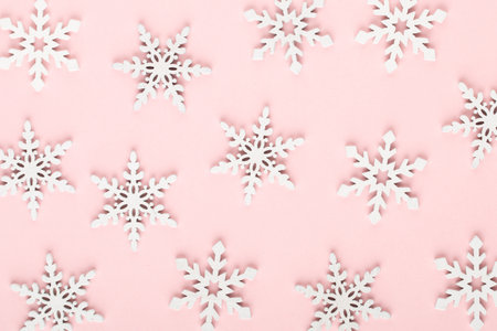 White snow decorations on a pinkの写真素材