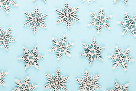Christmas background. White snow decorations on a blue background.の写真素材