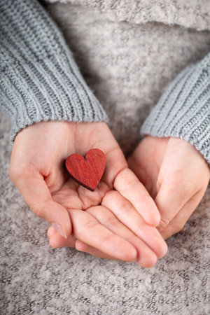 Red heart in handsの写真素材