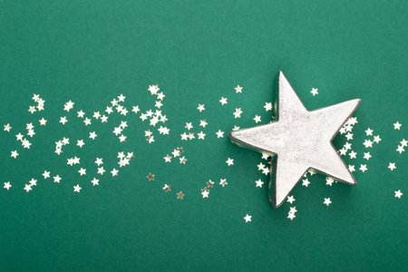 Glittering christmas background. Star dust and golden glitter. Holidays background for web and print.の写真素材