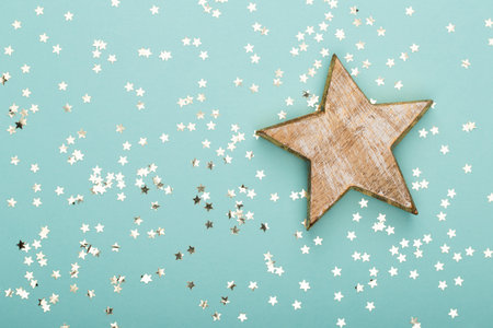 Glittering christmas background. Star dust and golden glitter. Holidays background for web and print.の写真素材